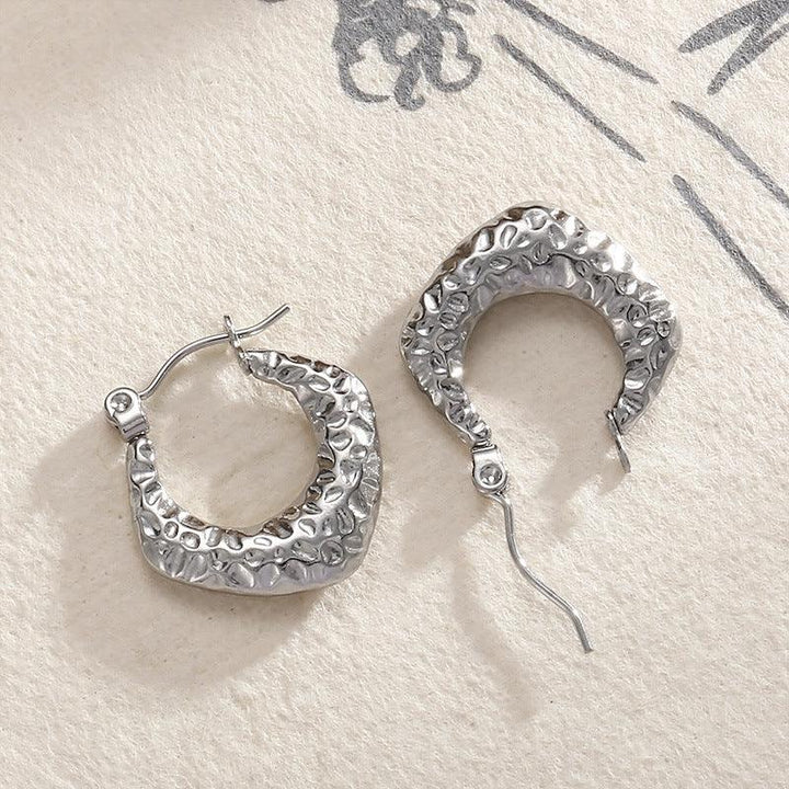 Stainless Steel Hollow C-Shape Hoop Earrings - kalen